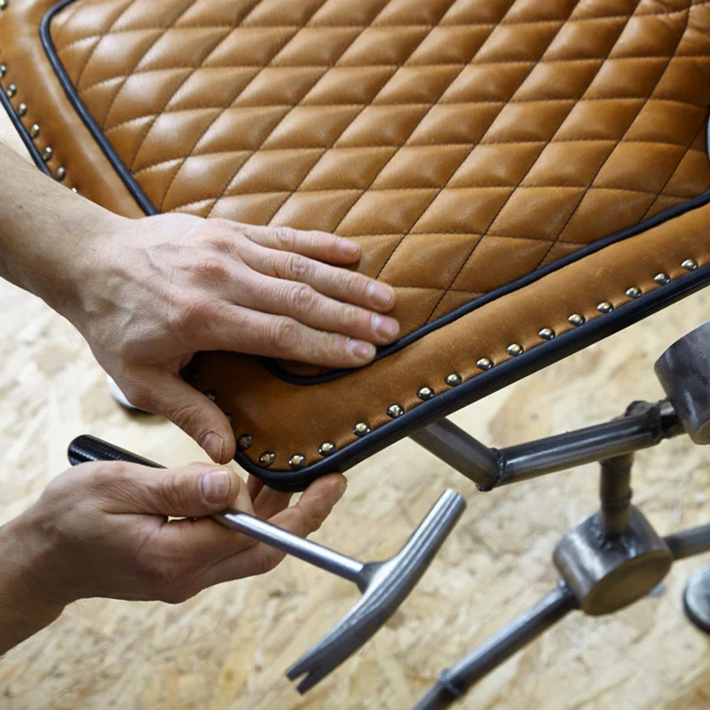 Leather quilting with decorative nails