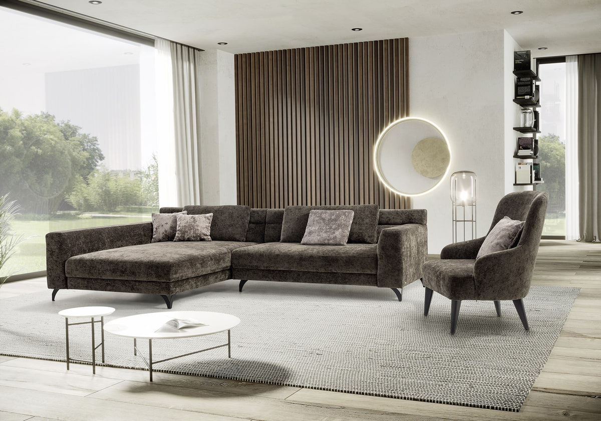 Wohnzimmer mit Couch und Sessel