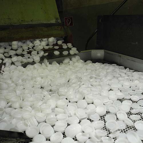 Plastic ground material