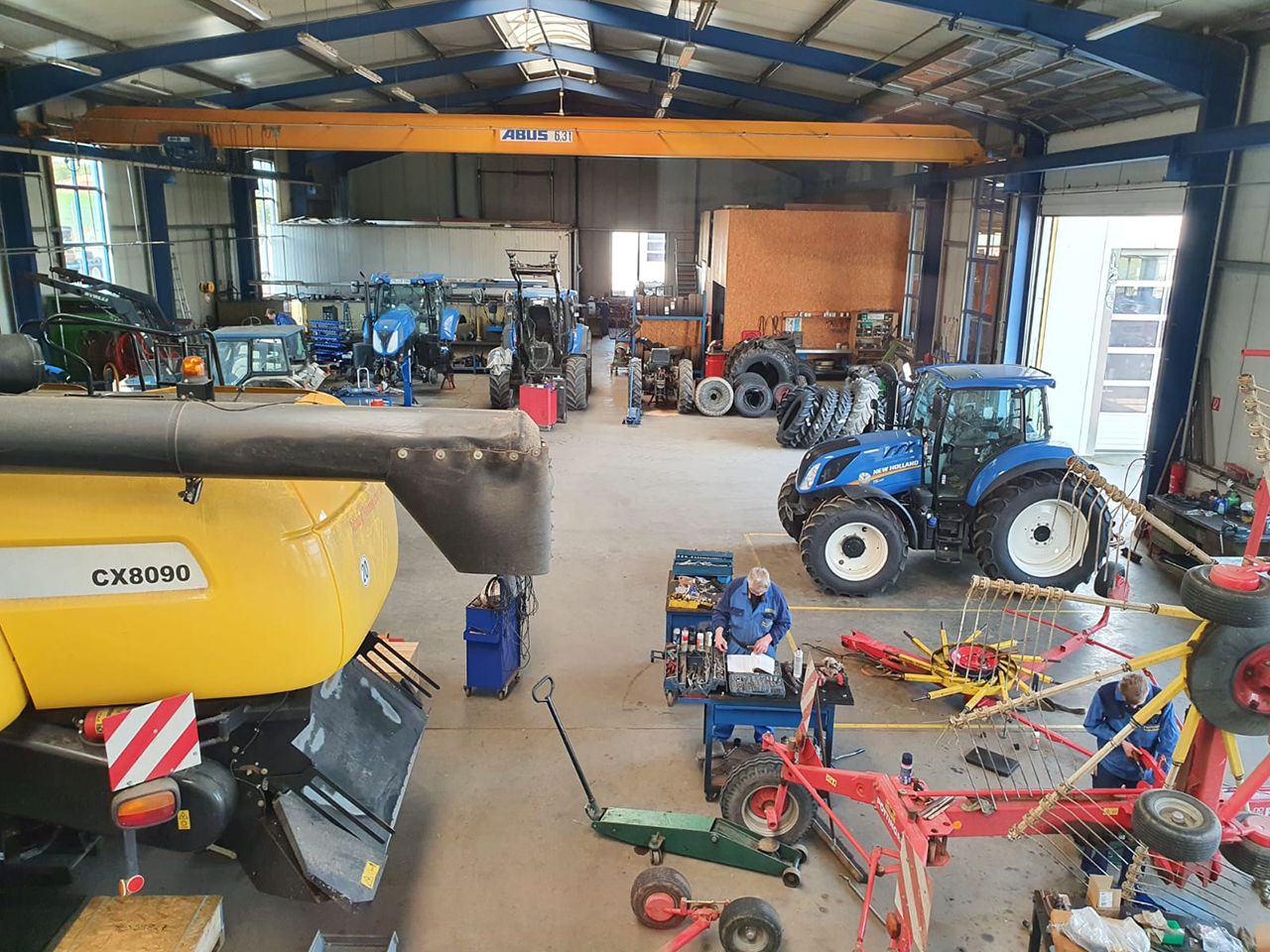 Workshop with tractor and agricultural equipment