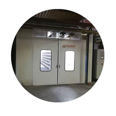 Powder booth with floor extraction and filter modules
