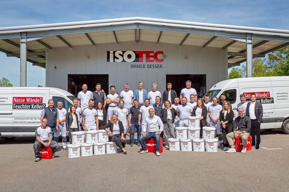 ISOTEC team in front of the company hall