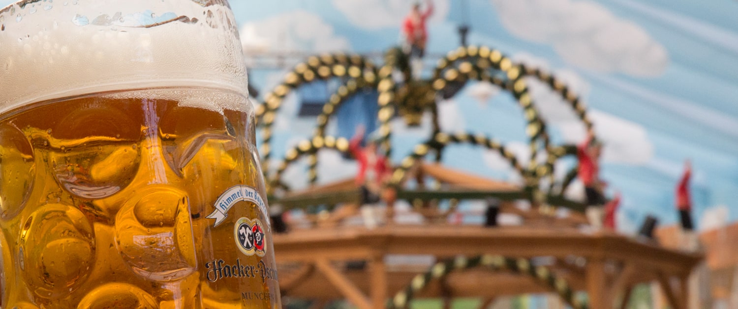 Festival tent interior with beer mug and Schäffler stage