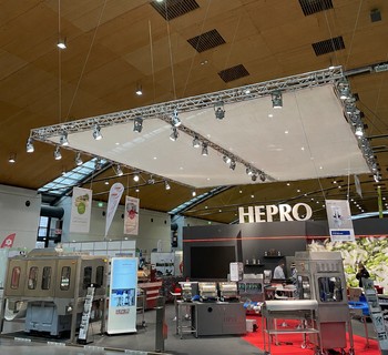 HEPRO trade fair booth with peeling and packaging machines
