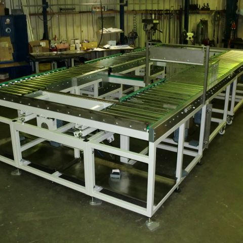 Roller conveyor with chain corner transfer