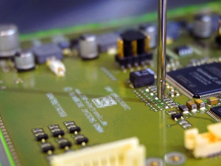PCB under the coating nozzle