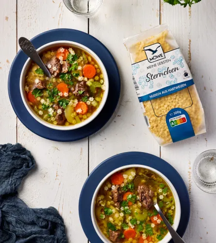 Vegetable and beef soup with star pasta