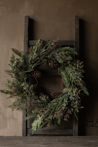 Winter wreath with fir greenery and pine cones