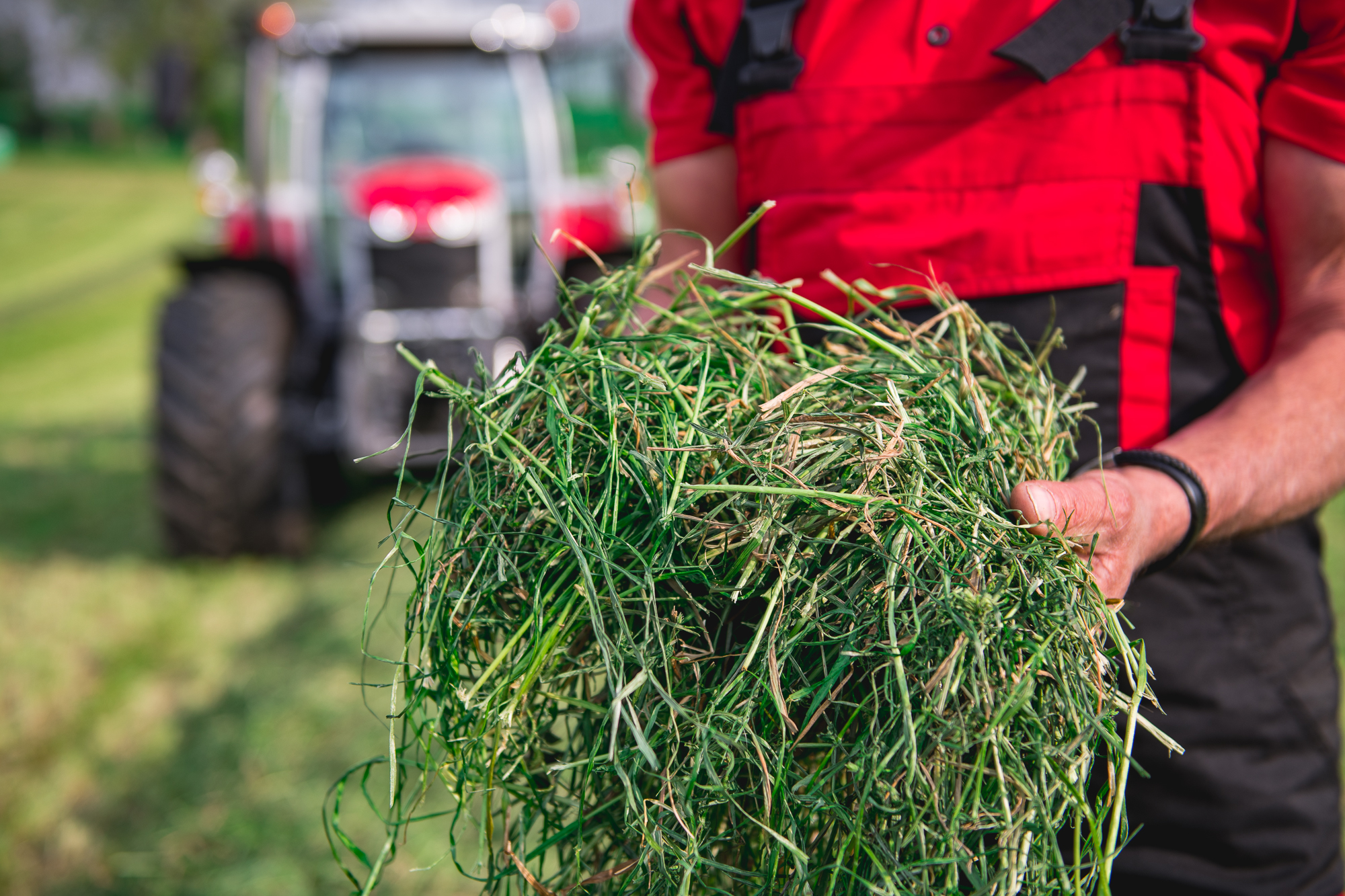 Tractor with round baler on field assignment