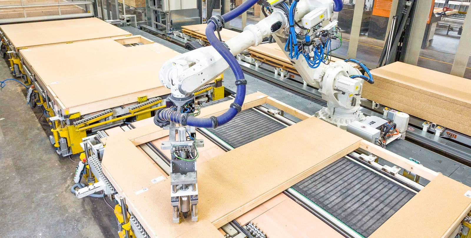 Automatisierte Beplankung von Fertighauswänden (Roboter)