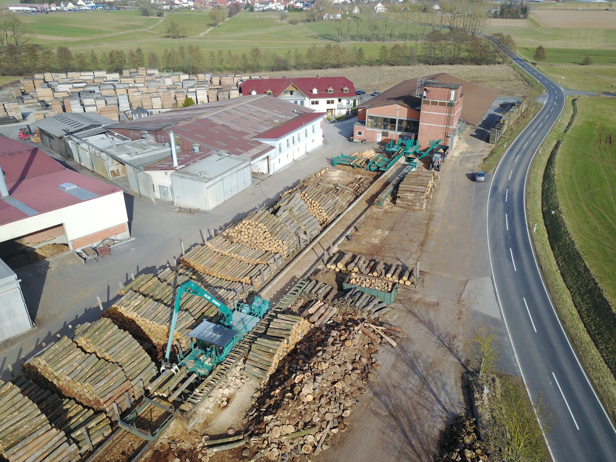 Wood-processing facility with logs and machinery