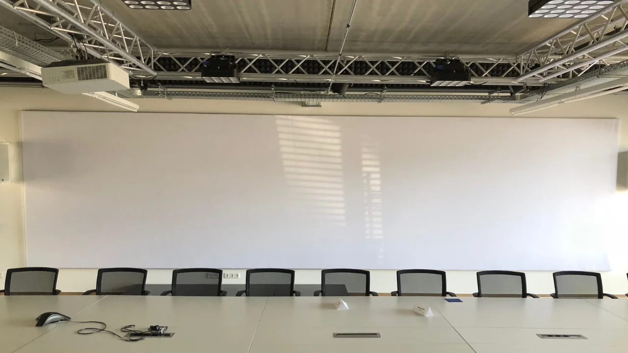 Video conference room with sound-absorbing video screen
