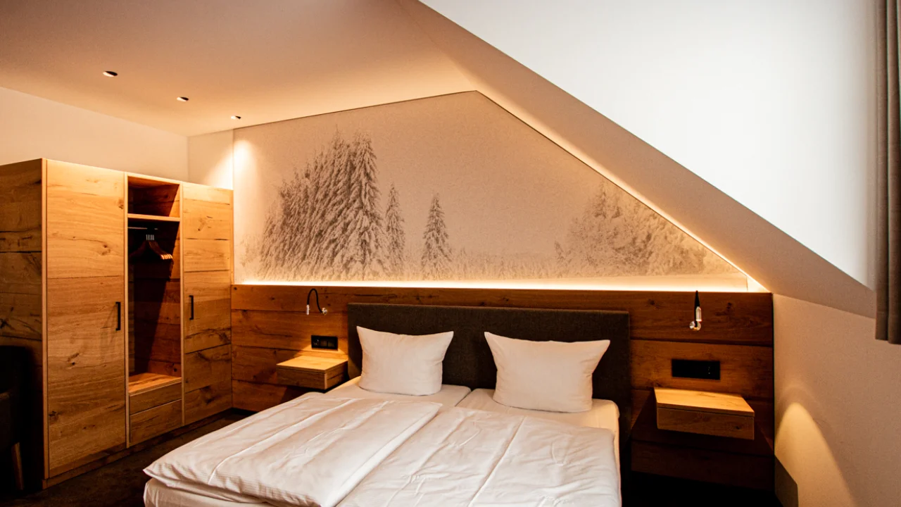 Hotel room with large-format acoustic image in the sleeping area