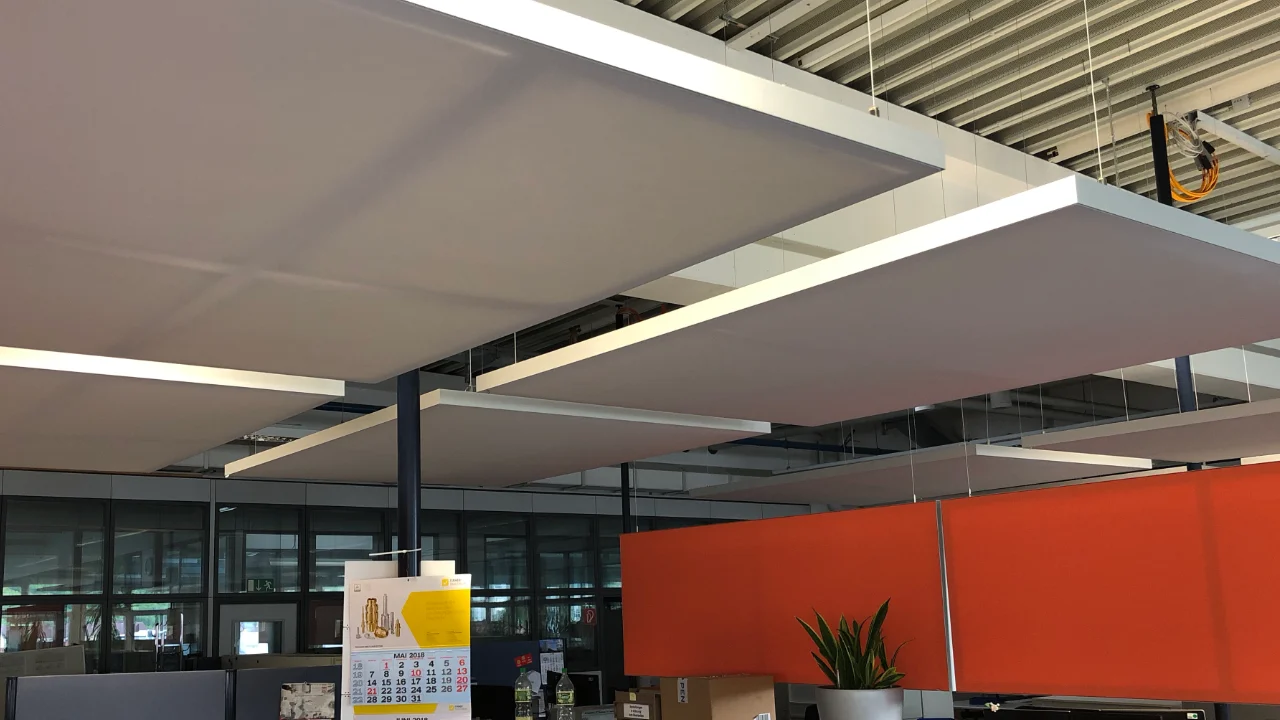 Suspended acoustic ceiling sails above the service desk
