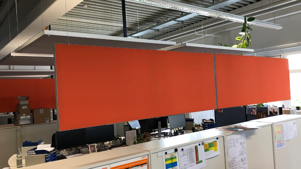 Service desk area of an industrial hall with ceiling sails and baffles