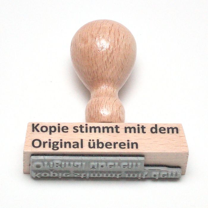 Holzstempel-Abdruck stimmt mit dem Original überein