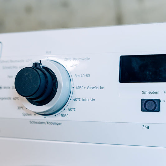 Feelware Audio Bedienknopf auf dem Programmwahlknopf einer Waschmaschine