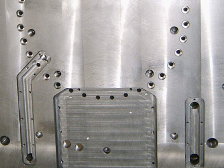 Plate with drilled and milled features