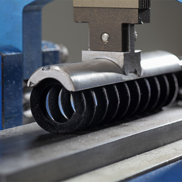 Handling of flocked springs