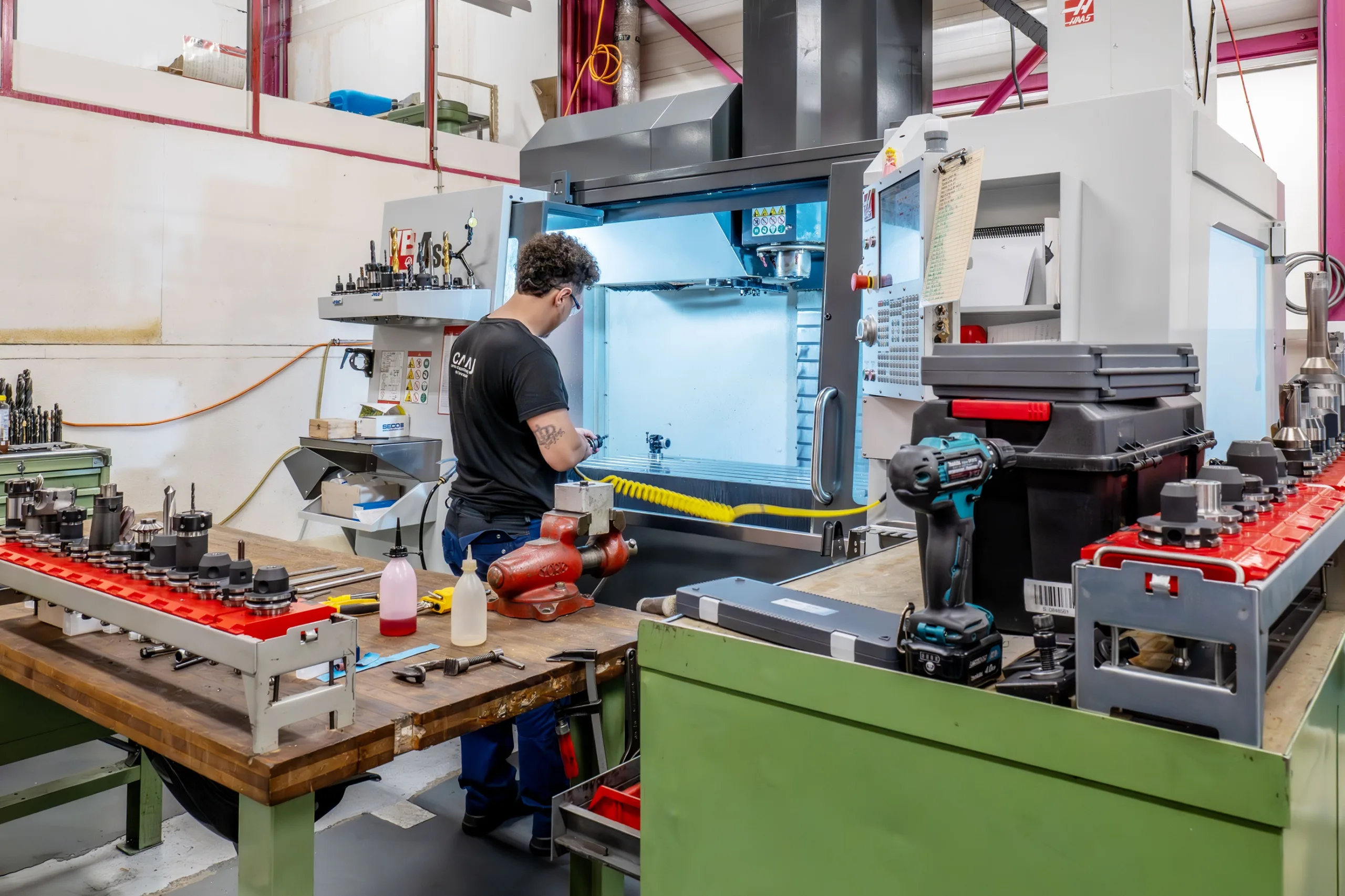 Employee at a Haas CNC machine