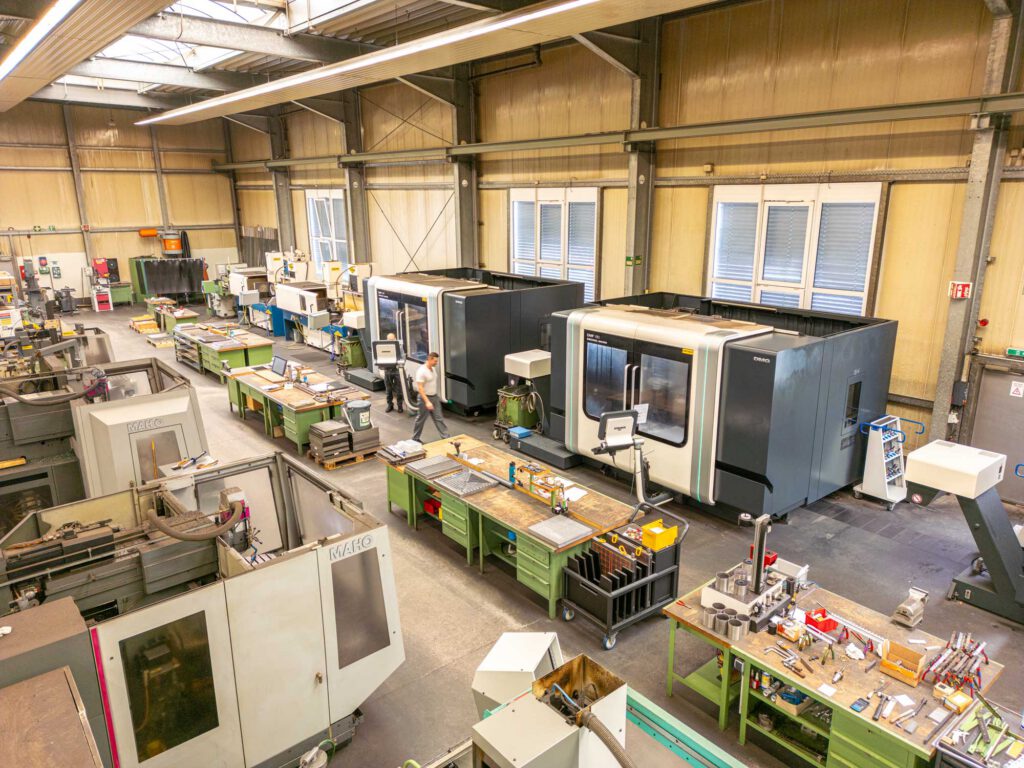 CNC machines and workbenches in mold making