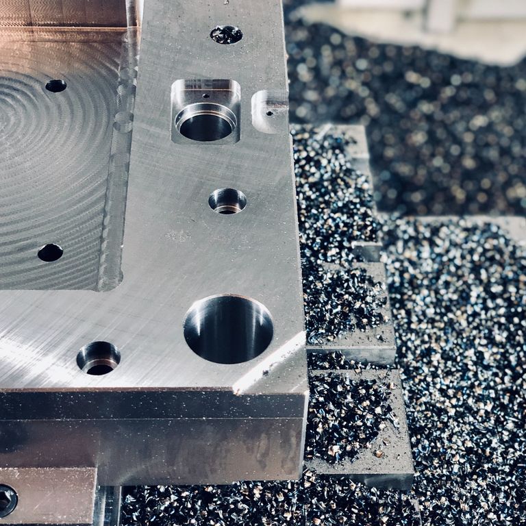 Overmoulded metal insert