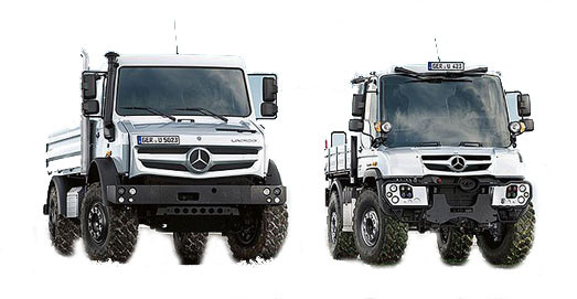 Zwei weiß lackierte Unimog