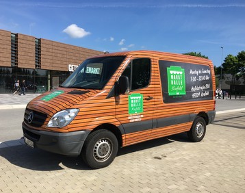 Vollfolierung real,- Markttransporter