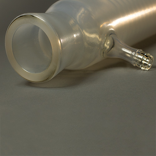 Piston with chip protection coating on glass