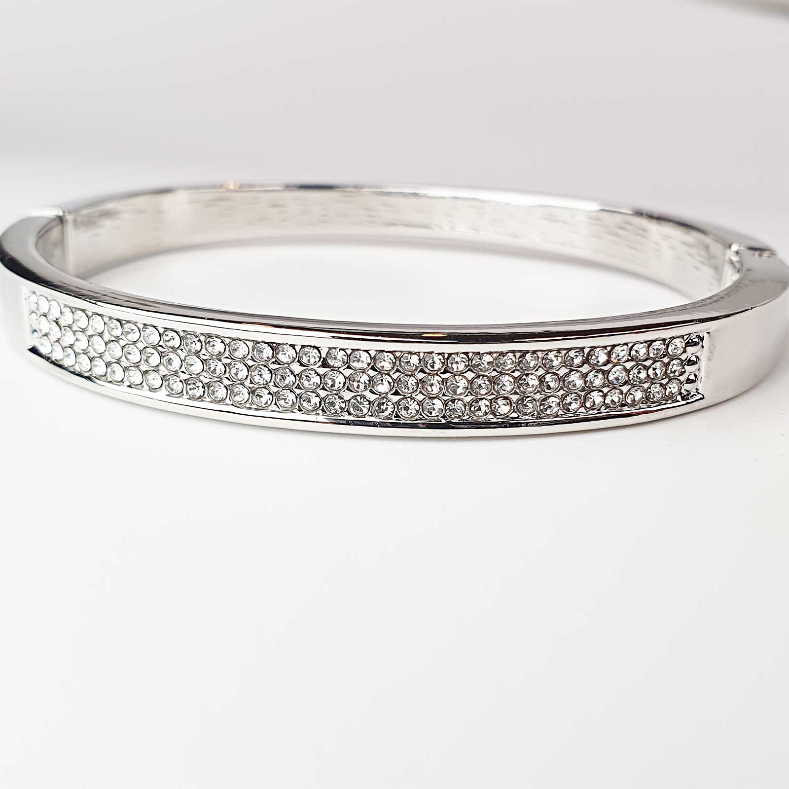 Silver women's bangle with zirconia setting